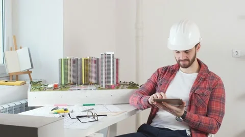 Young architect working in the office. Stock Footage 130727865