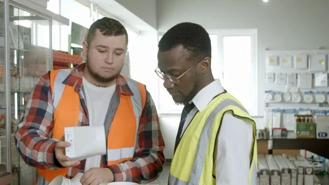 Young architects checking plastic parts Stock Footage 125455684