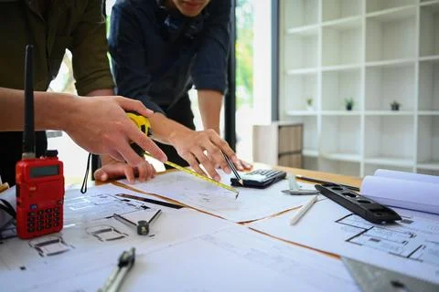 Young architects working on project ,collaborating, planning working together in Stock Photos