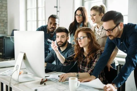 Young architects working on project in office Stock Photos