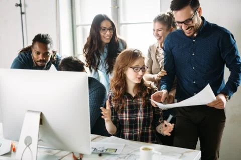Young architects working on project in office Stock Photos