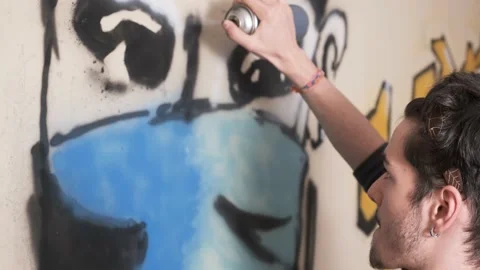 Young artist creating social distancing graffiti message Stock Footage 142090873