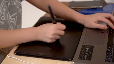 Young artist using  drawing tablet Stock Footage 131910869