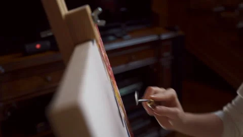 Young artist, using a palette knife, creates a modern masterpiece of painting Stock Footage 197366226
