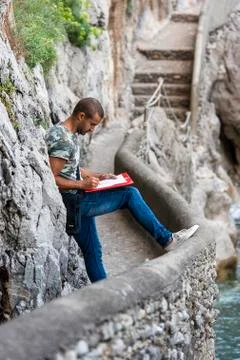 Young artist while drawing. Stock Photos