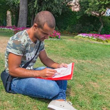 Young artist while drawing. Stock Photos