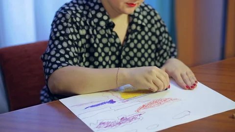 A young artist is working on a drawing using the pastel technique. Stock Footage 126285603