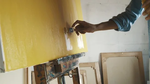 Young artist working in his studio Stock Footage 128686835