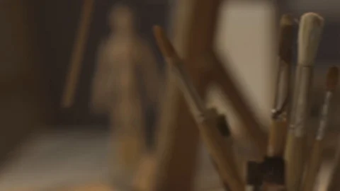 Young artist working in the studio and painting on canvas Stock Footage 127418376
