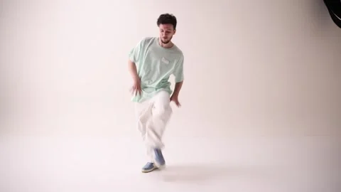 Young artistic man dressed casual, oversized stylish outfit, dance freestyle in Stock Footage 303347906