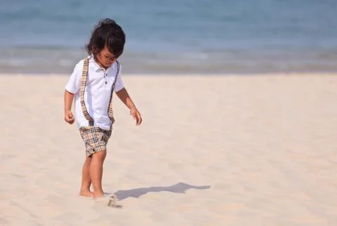 Young asain boy on beach Stock Photos