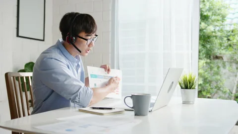 Young Asia businessman using computer talk to colleagues in video call. Stock Footage 136846831
