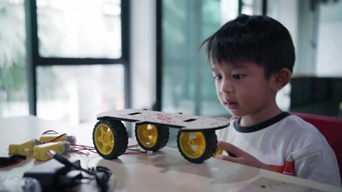 Young asia student learn online at home in coding robot arduino remotely Video stock 247120053