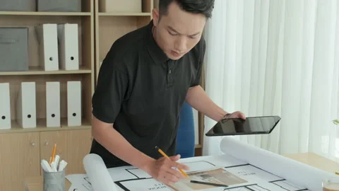 Young Asian Architect Working in Office and Posing for Camera Stock Footage 233290733