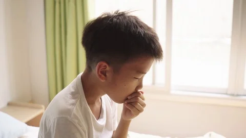 Young Asian boy getting sick Stock Footage 102648747