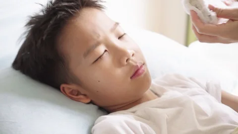 Young Asian boy getting sick Stock Footage 103971211