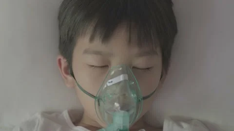 Young asian boy with oxygen Stock Footage 138722957