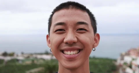 Young asian boy smiling on camera Stock Footage 164378869
