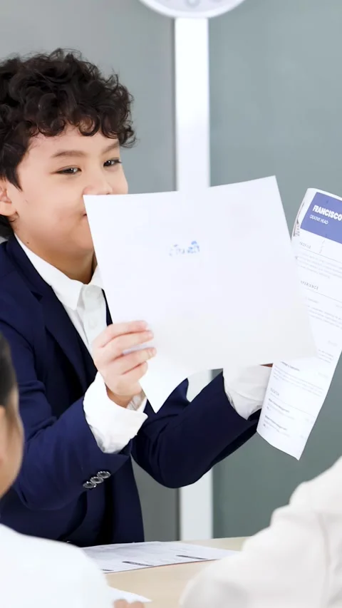 Young Asian Boy in Suit Acting as Manager During Office Interview Stock Footage 329659911