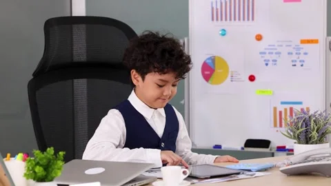 Young Asian Boy Using Tablet and Calculator at Office Desk Stock Footage 337086789