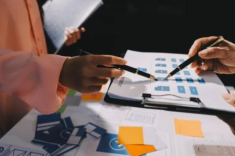 Young Asian business creative team work together, mobile application softwa.. Stock Photos