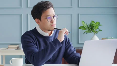 Young asian businessman using computer laptop, idea thinking and inspiration Stock Footage 147522134