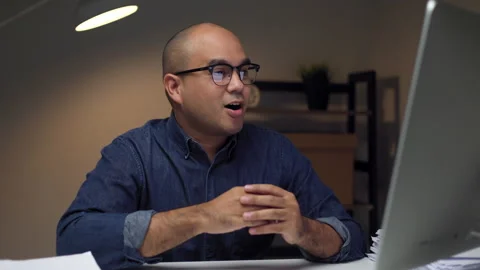 Young asian businessman working with computer video conference in the dark. Stock Footage 161704342