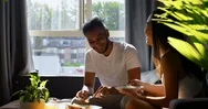 Young Asian Couple Eating Food In Living Room At Home 4K Stock Footage
