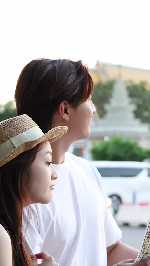 Young Asian Couple Reading Map Near City Temple Stock Footage 323434211