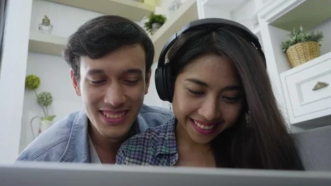 Young asian couple using labtop for shopping online. Video stock 87046271