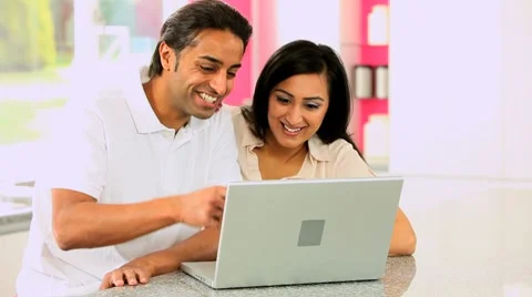Young Asian Couple Using Laptop Computer Stock Footage 8779541