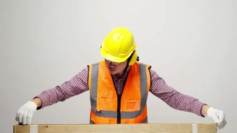 Young asian craftsman checking quality of wood and use measuring tape for calcul Stock Footage 144262404