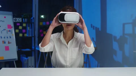 Young asian designer female using vr glasses testing mobile app from develop. Stock Footage 132140480