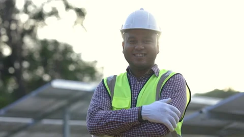 Young asian electrical engineer standing with arm crossed in front of Solar cell Video stock 158902761