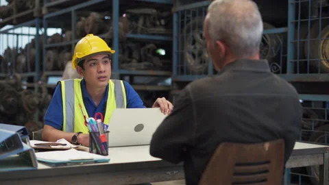 Young asian engineer salesman worker using laptop computer and calculator to Stock Footage 153569730
