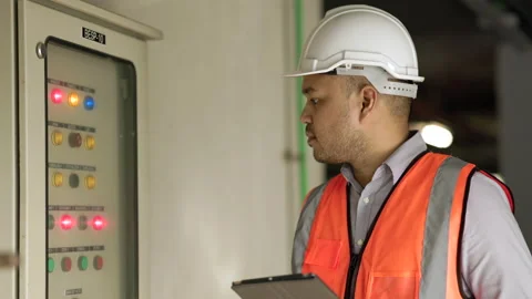 Young asian engineer working at electric cabinet checking and maintenance for th Stock Footage 162293883