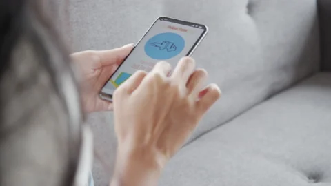 Young asian female checking parcel delivers order on smartphone application. Stock Footage 139868096