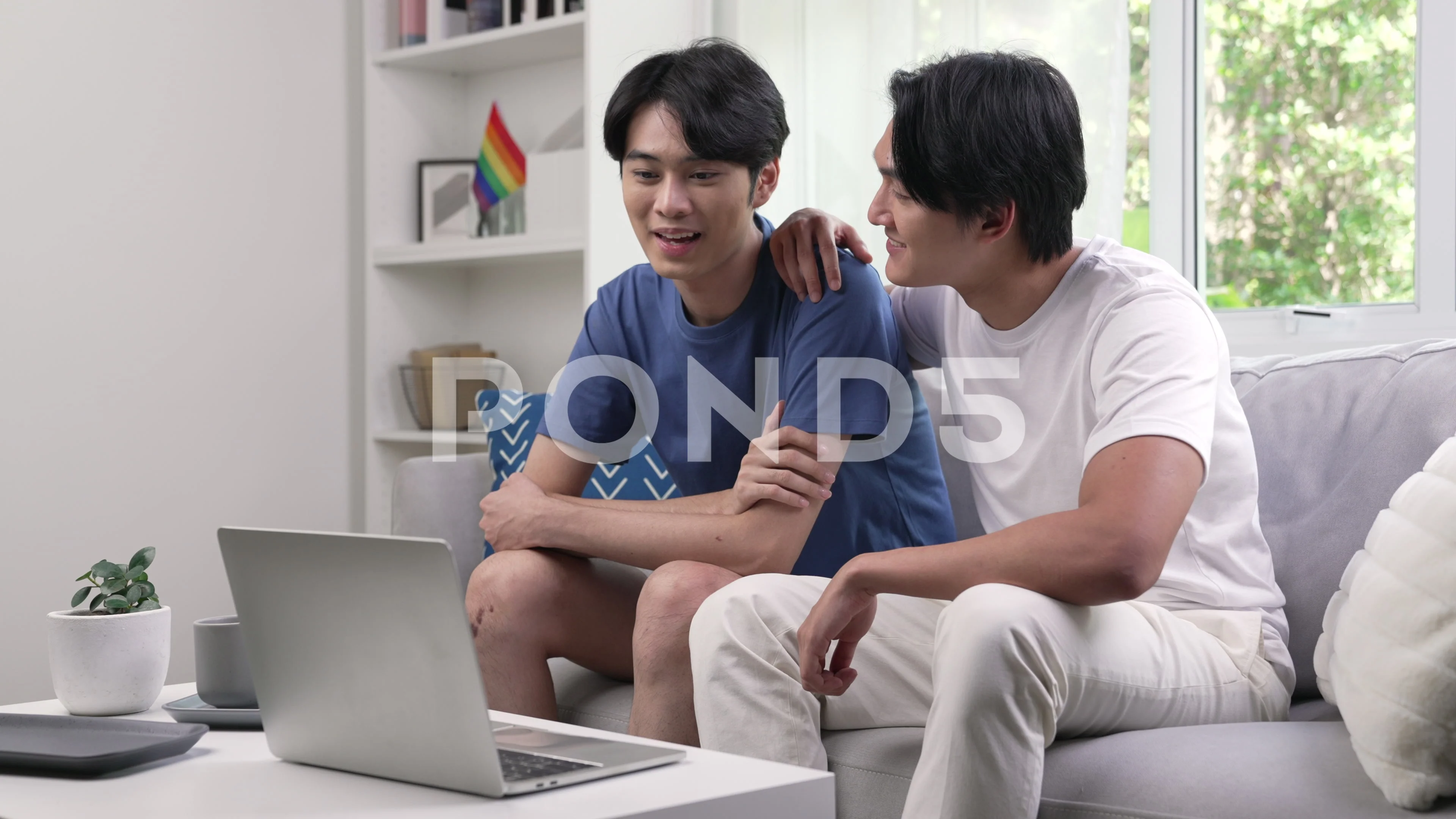 Young Asian gay couple video call to the... | Stock Video | Pond5