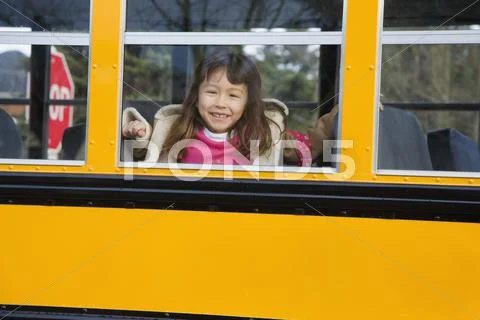 Young Asian Girl On School Bus