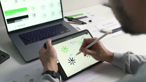 Young Asian Graphic designer working in office. Designing logo Artist Creative Stock Footage 274489612