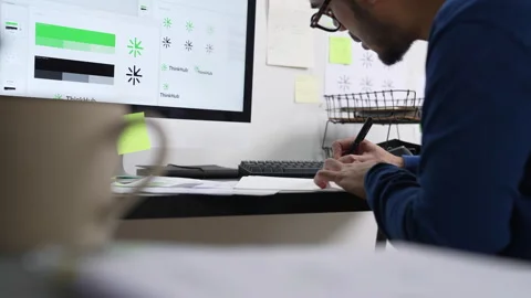 Young Asian Graphic designer working in office. Designing logo Artist Creative Stock Footage 276128642