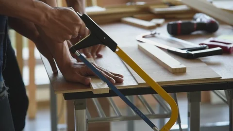 Young Asian group man worker cutting wood plank for build diy wood furniture Stock Footage 124103233