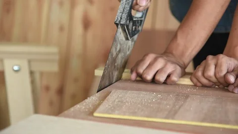Young Asian group man worker cutting wood plank for build diy wood furniture Stock Footage 124183869