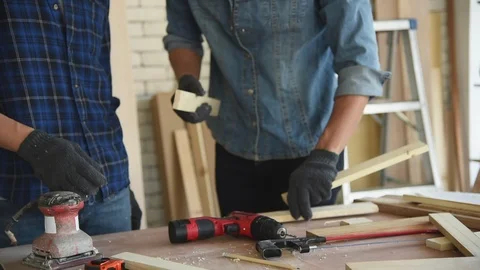 Young Asian group man worker using electric hand drill Stock Footage 124884639