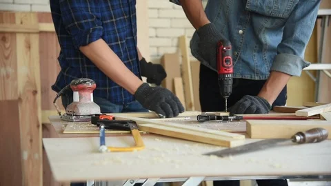 Young Asian group man worker using electric hand drill Stock Footage 124884866