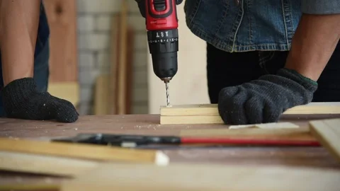 Young Asian group man worker using electric hand drill Stock Footage 124885089