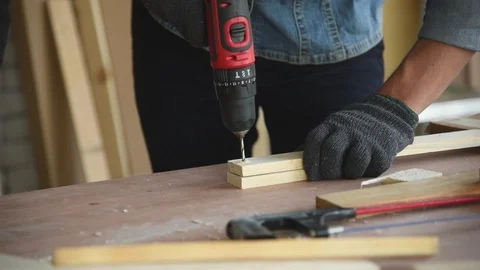 Young Asian group man worker using electric hand drill Stock Footage 124887132