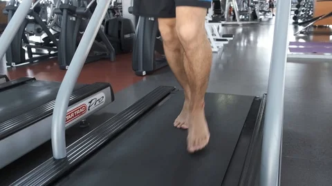 Young Asian guy is running on a treadmill in a gym. Stock Footage 114291060