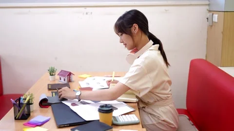 Young Asian interior design student diligently working on creative project .. Stock Footage 333520132