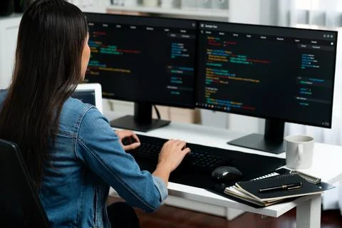 Young Asian in IT creating with typing online information on pc. Stratagem. Foto stock